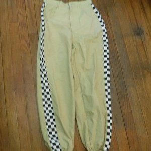 tan and checker windbreaker utility pants.